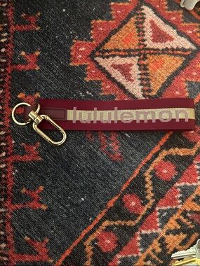 Lululemon Burgundy and Gold Keychain